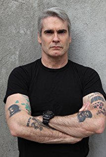 How tall is Henry Rollins?